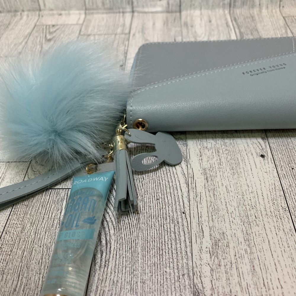 Baby blue keychain wallet with Broadway Argan Oil